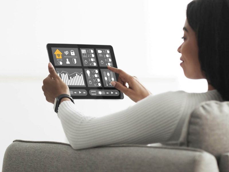 african-american-woman-using-smart-home-automation-assistant.jpg